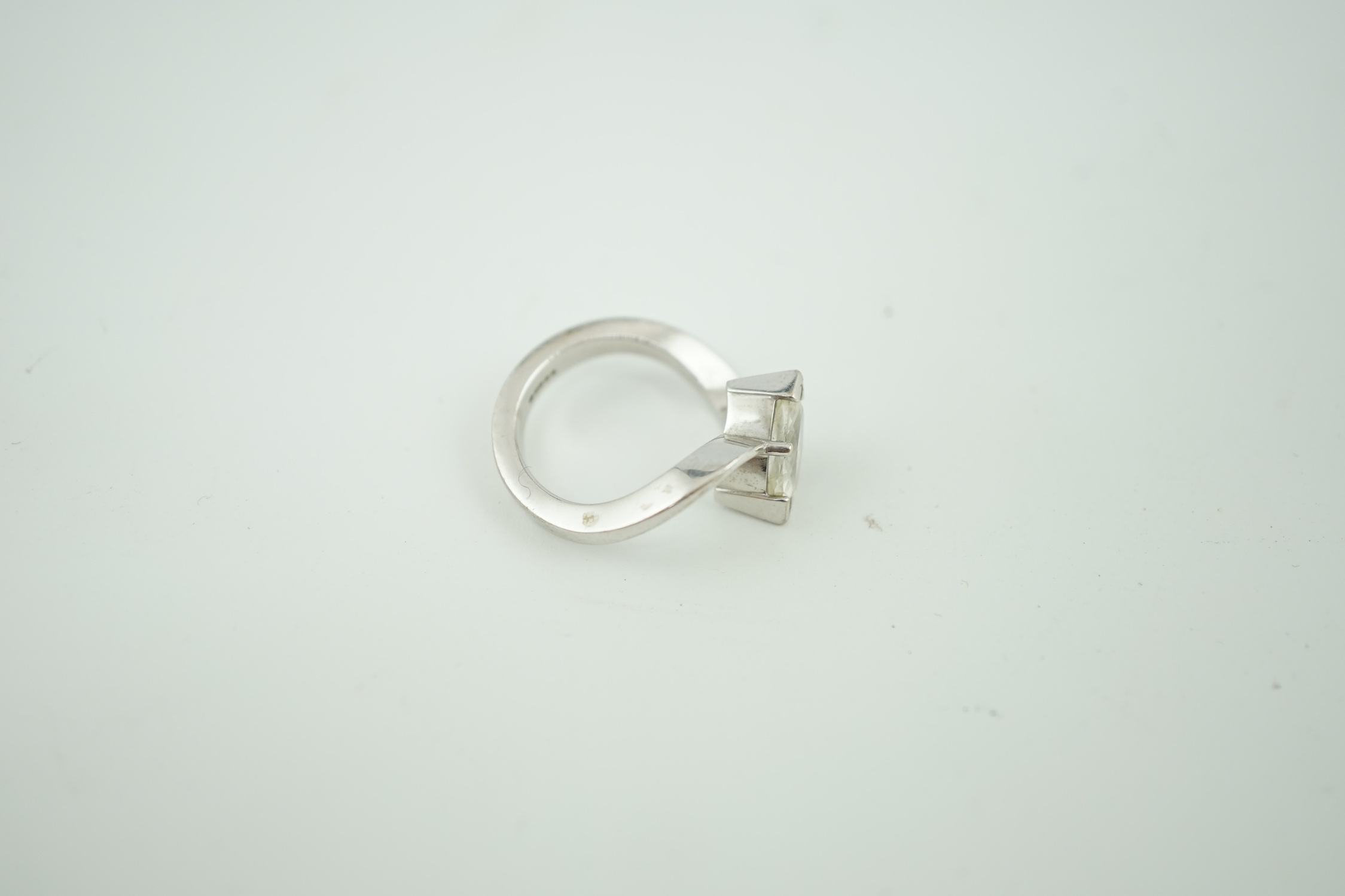 A modern 18ct white gold and solitaire marquise cut diamond set ring